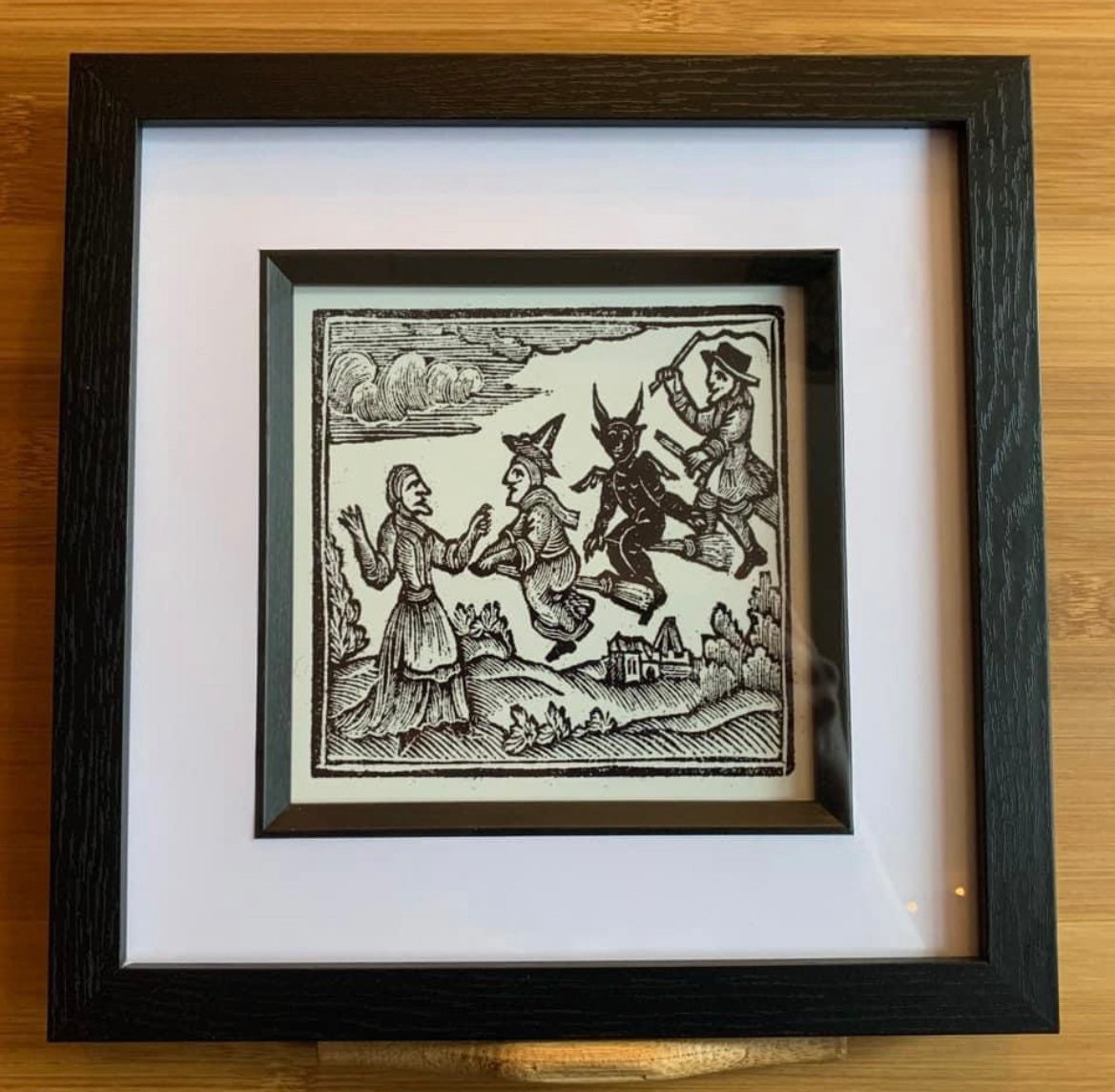 Framed print of Woodcut Witches and Devil on Broomstick